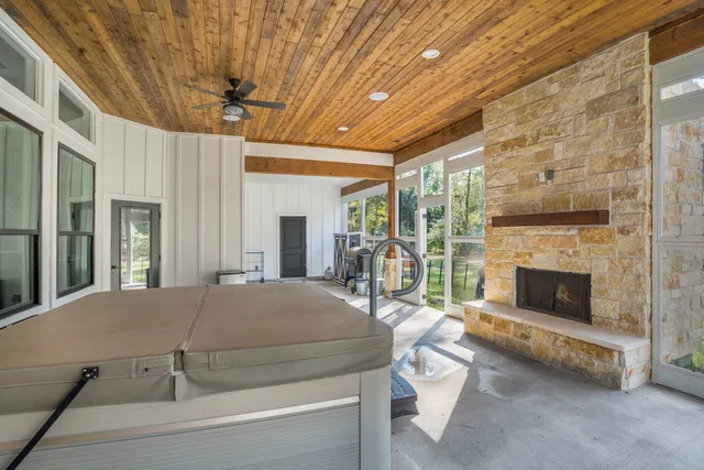 a bedroom with furniture and a fireplace