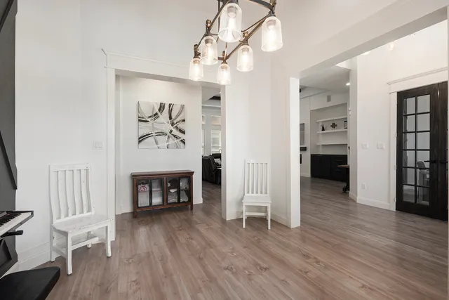 a view of a livingroom with furniture and wooden floor