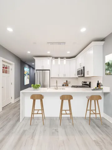 a kitchen with a table and chairs in it
