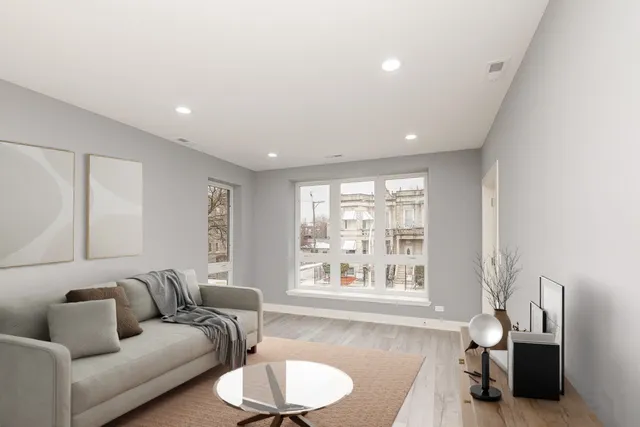 a living room with furniture and a large window