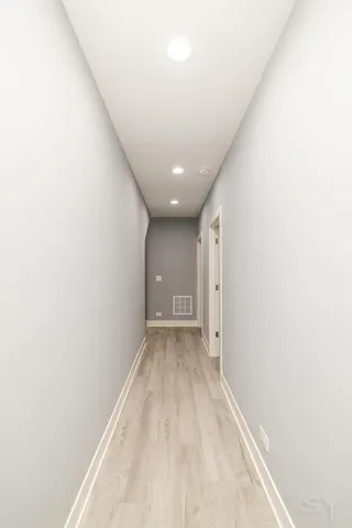 a view of a big room with closet and windows