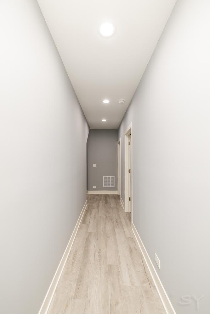 1232 South Fairfield Avenue, Unit 2 Chicago, IL 60608 - Photo 7 of 10 a view of a big room with closet and windows