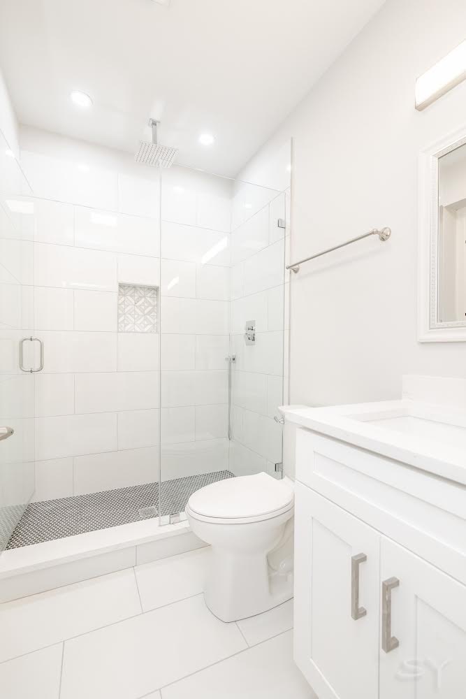 1232 South Fairfield Avenue, Unit 2 Chicago, IL 60608 - Photo 10 of 10 a bathroom with a toilet and a shower