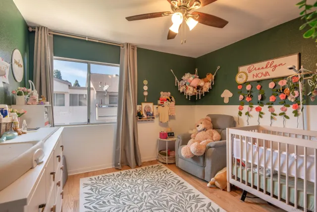 a bedroom with furniture and wooden floor