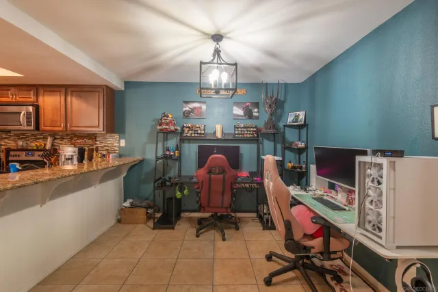a dining room with furniture and chandelier
