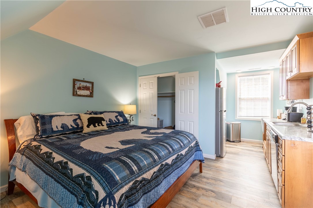 449 Meadow Ridge Drive Jefferson, NC 28640 - Photo 26 of 37 a bedroom with bed and a window
