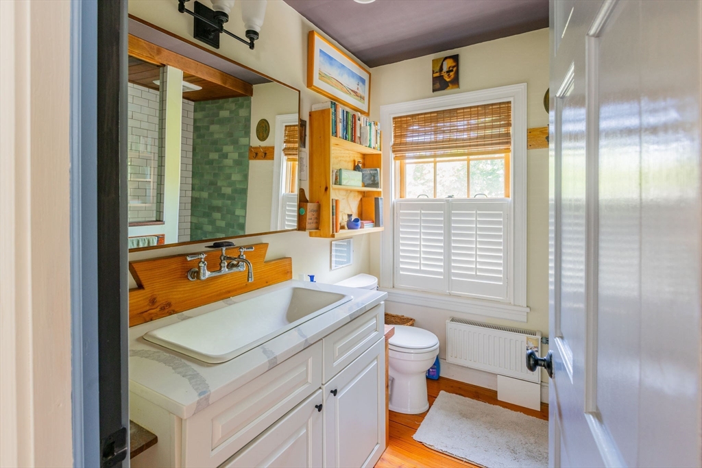 27 Maverick Street Marblehead, MA 01945 - Photo 13 of 31 a bathroom with a sink and a mirror