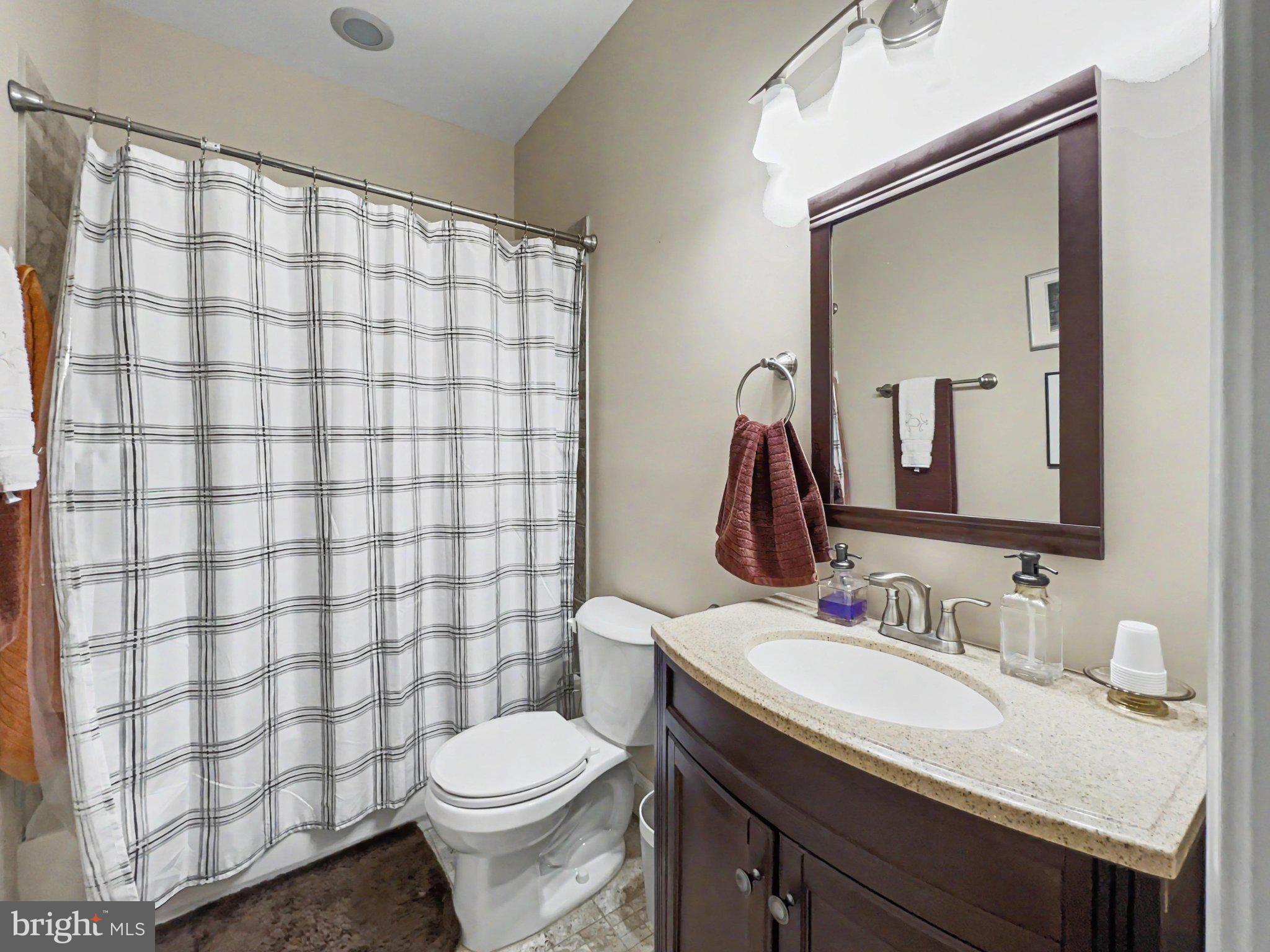 1610 North Broadway Baltimore, MD 21213 - Photo 11 of 18 a bathroom with a sink toilet and shower