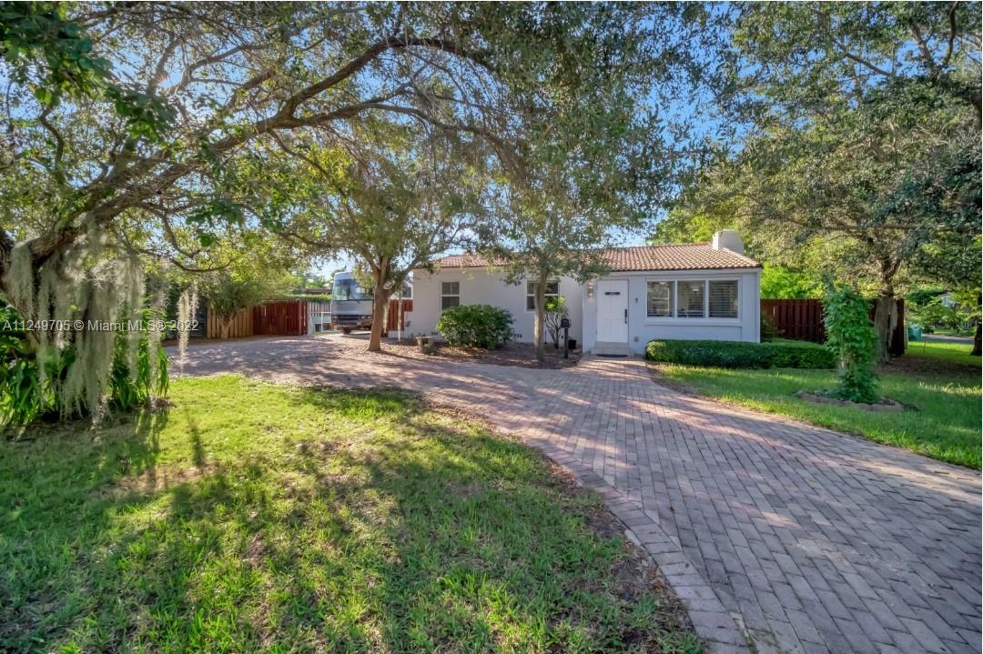 4290 Southwest 11th Street Miami, FL 33134 - Photo 1 of 20 a view of a house with backyard and sitting area