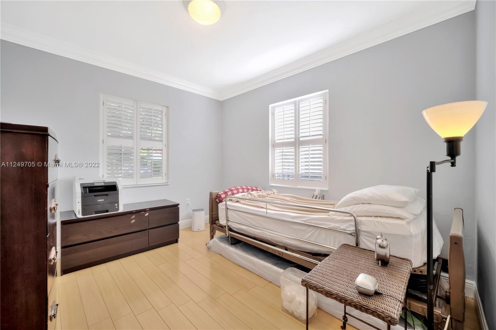 4290 Southwest 11th Street Miami, FL 33134 - Photo 15 of 20 a bedroom with a bed and furniture
