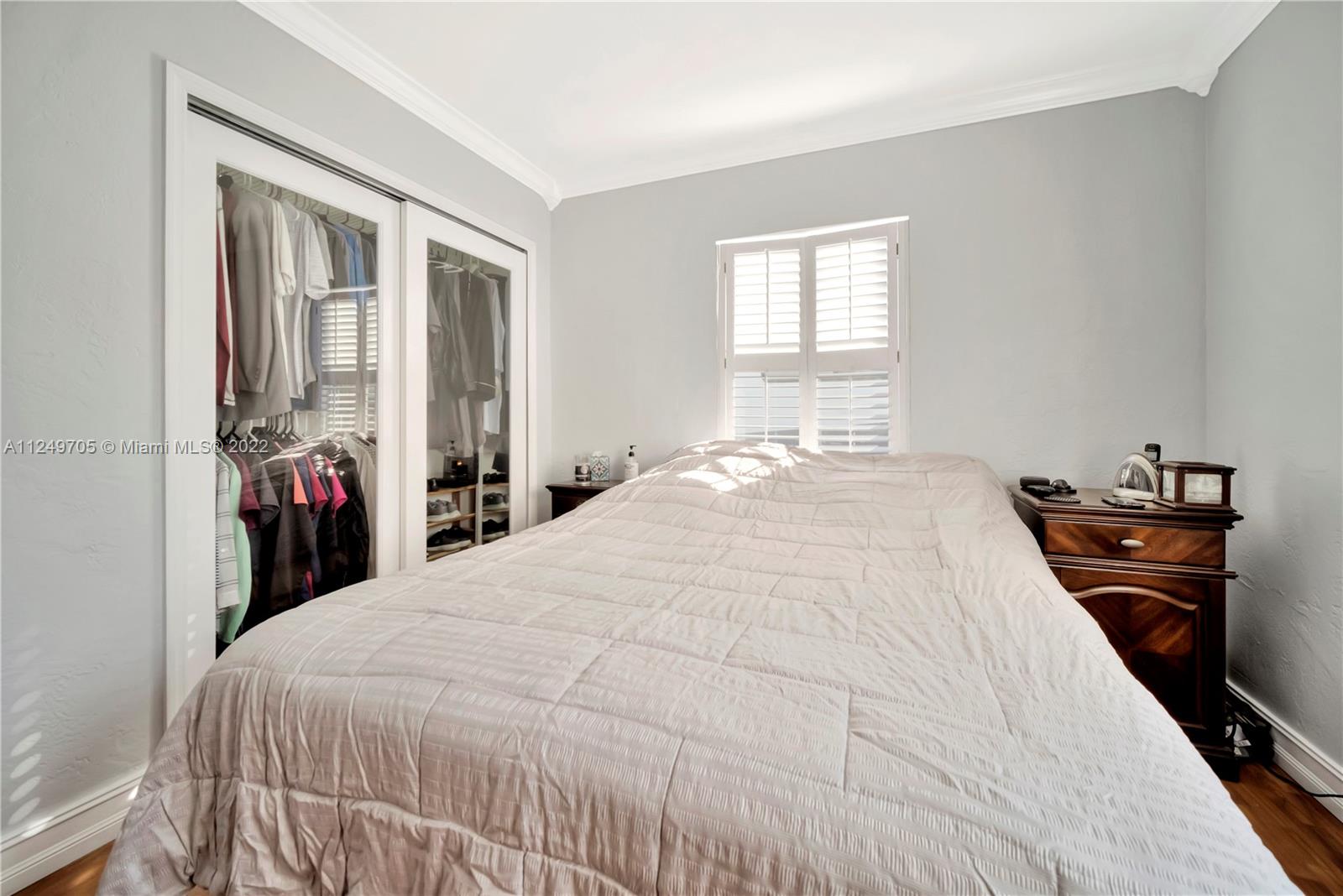 4290 Southwest 11th Street Miami, FL 33134 - Photo 17 of 20 a bedroom with a bed and a window