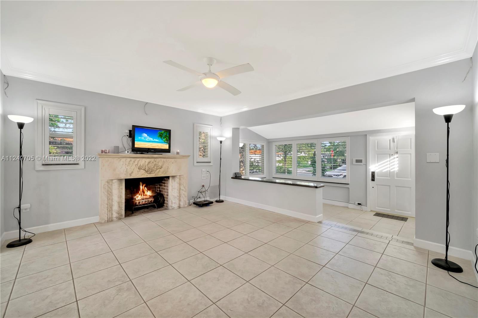 4290 Southwest 11th Street Miami, FL 33134 - Photo 5 of 20 a view of an empty room with a fireplace