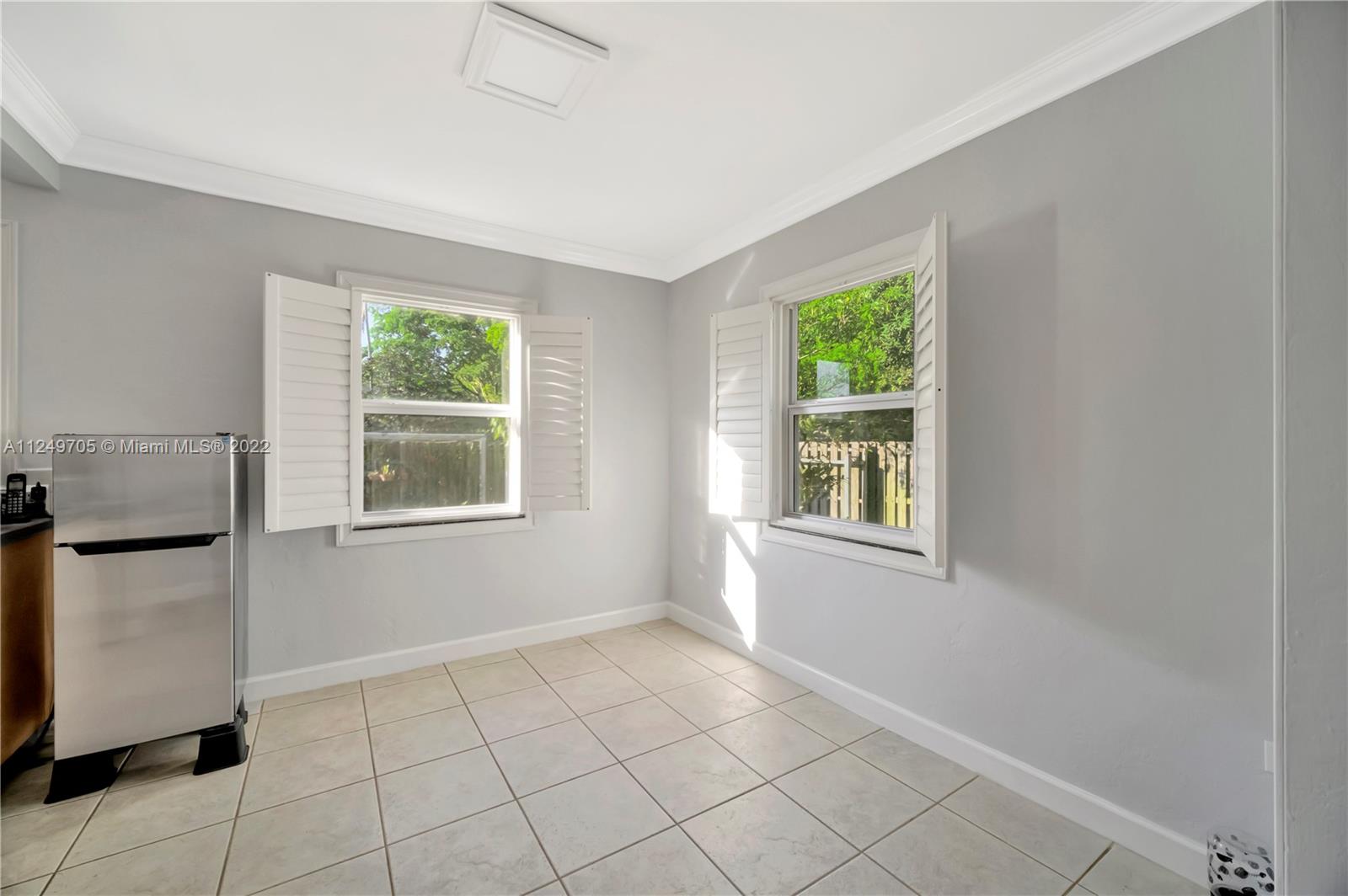 4290 Southwest 11th Street Miami, FL 33134 - Photo 8 of 20 a view of an empty room with a window
