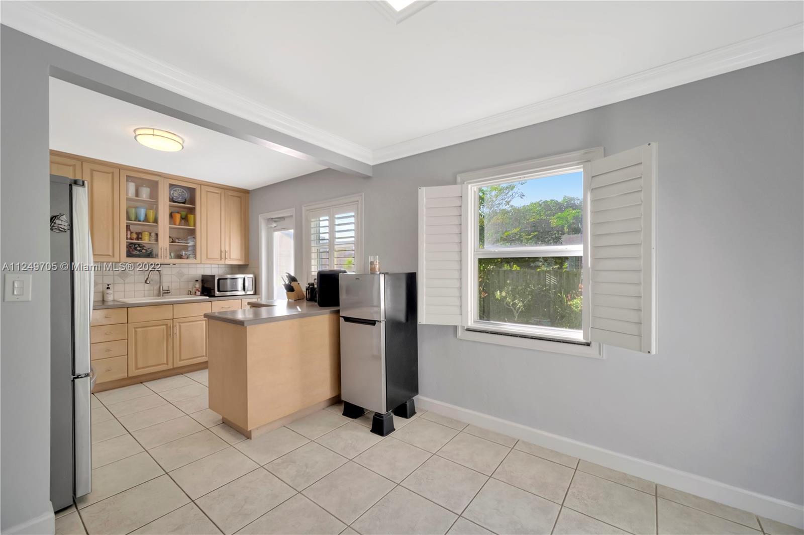 4290 Southwest 11th Street Miami, FL 33134 - Photo 9 of 20 a kitchen with sink and refrigerator