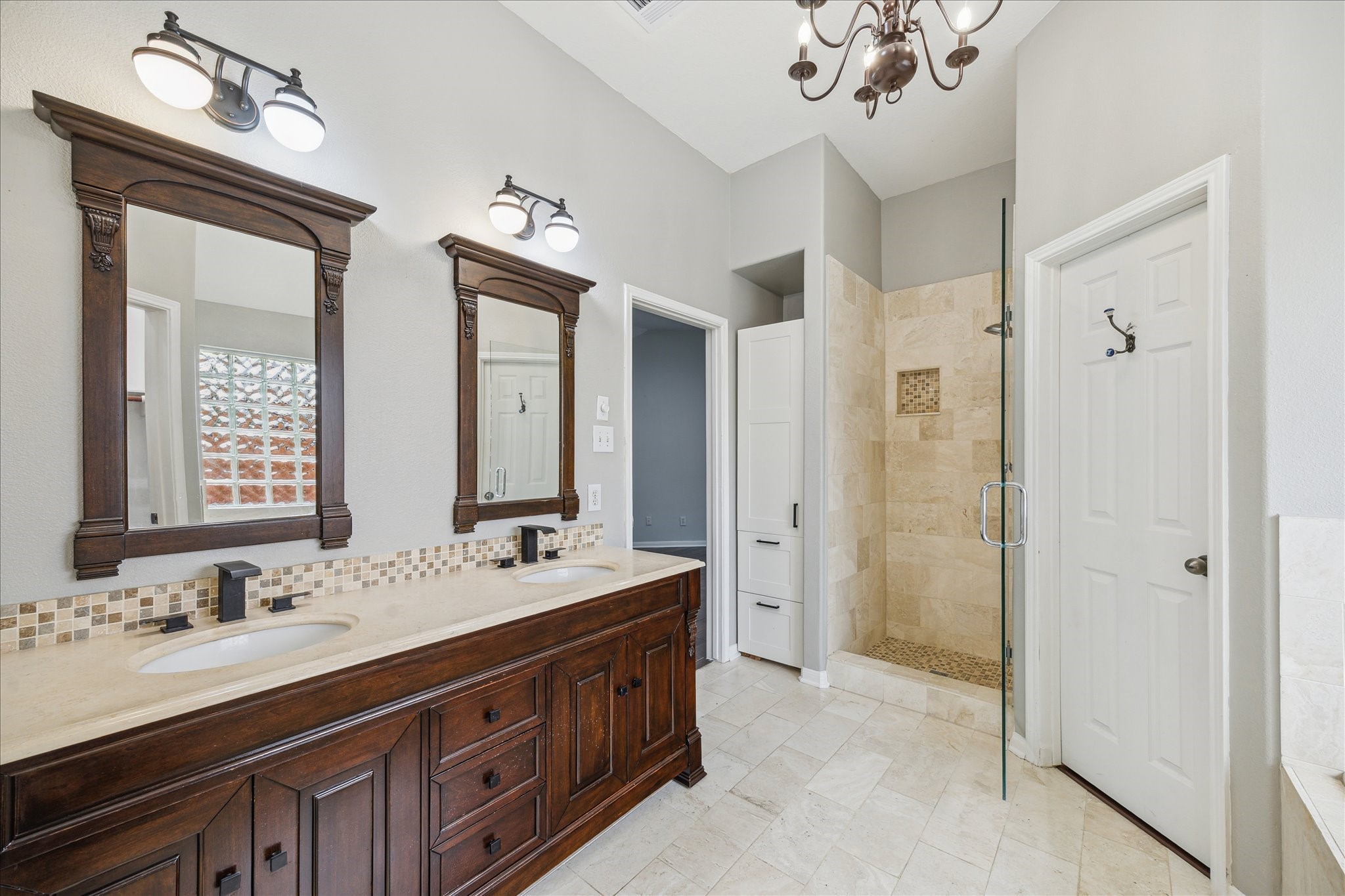 20910 Sandy Briar Court Spring, TX 77379 - Photo 22 of 28 a spacious bathroom with a double vanity sink mirror and double