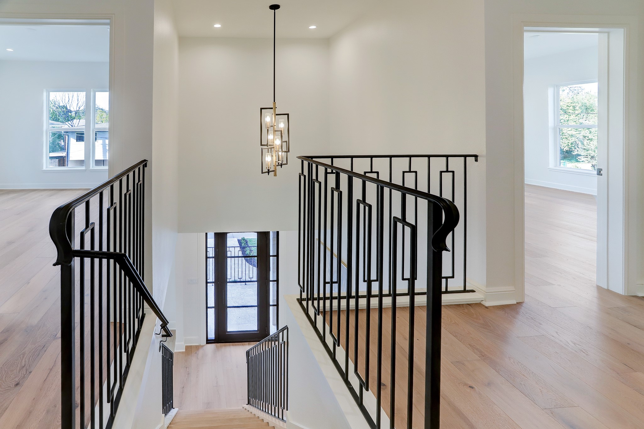 1601 Bonnie Brae Street Houston, TX 77006 - Photo 24 of 39 a view of staircase with wooden floor and a window