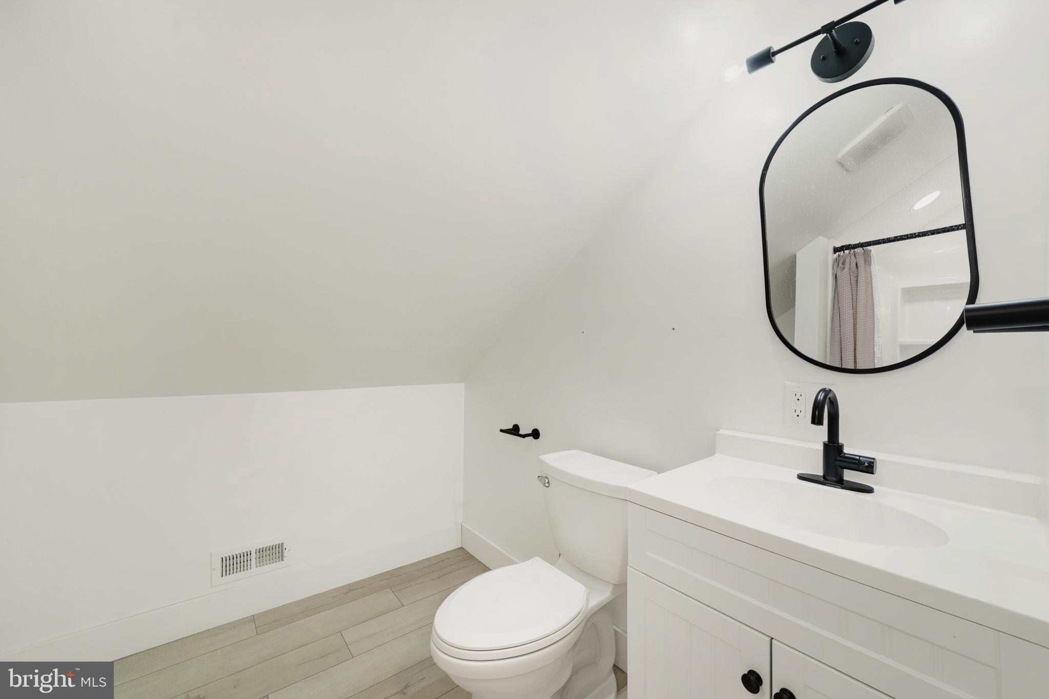 23 Old Bayview Road North East, MD 21901 - Photo 23 of 28 Sleek, modern bathroom with minimalist design.