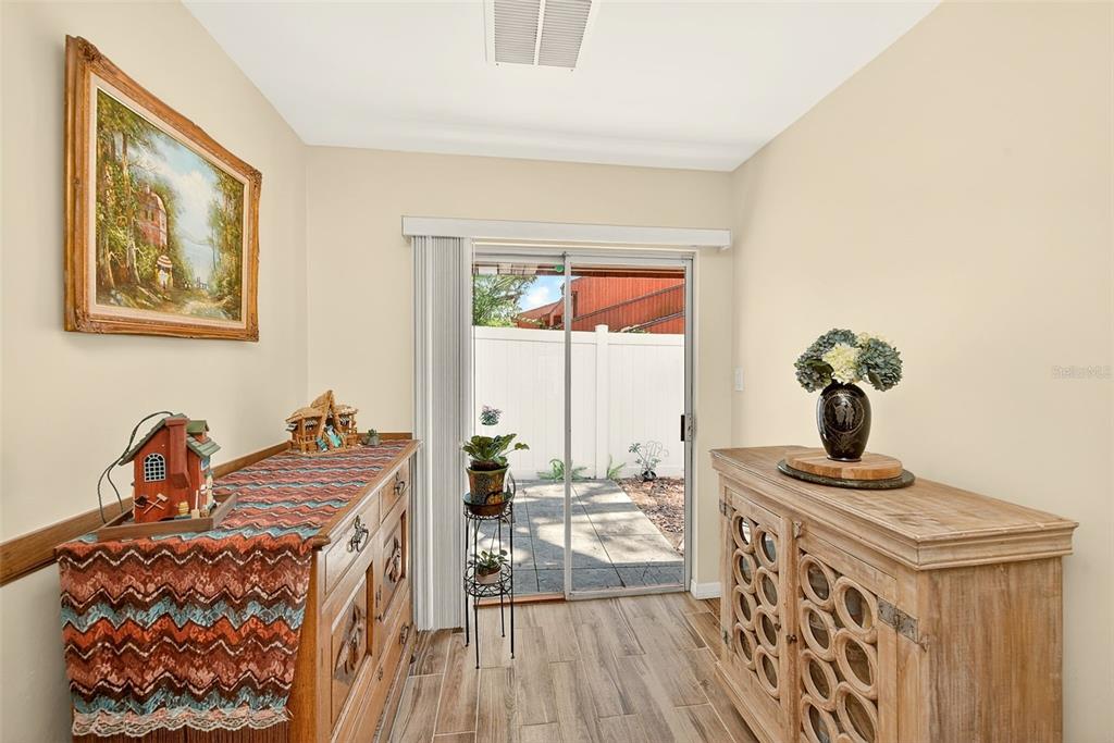 2064 Sunset Point Road, Unit 73 Clearwater, FL 33765 - Photo 22 of 58 a living room with furniture and a window