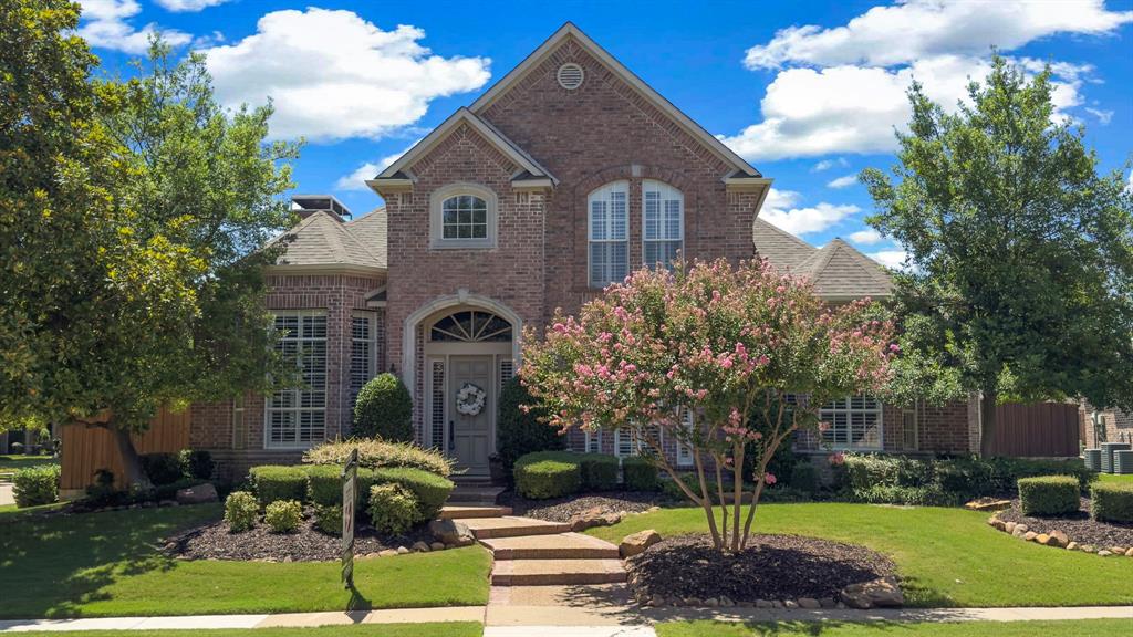 5640 Risborough Drive Plano, TX 75093 - Photo 1 of 1 a front view of a house with a yard