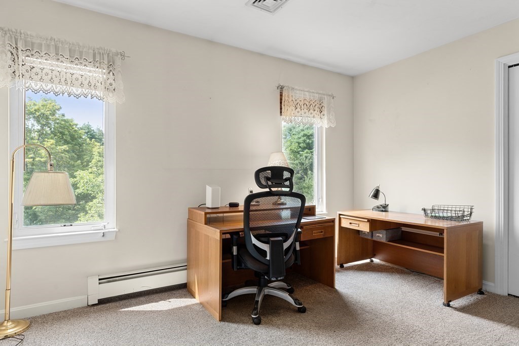 11 Longley Road, Unit H1 Shirley, MA 01464 - Photo 18 of 35 a view of a workspace with furniture and a window