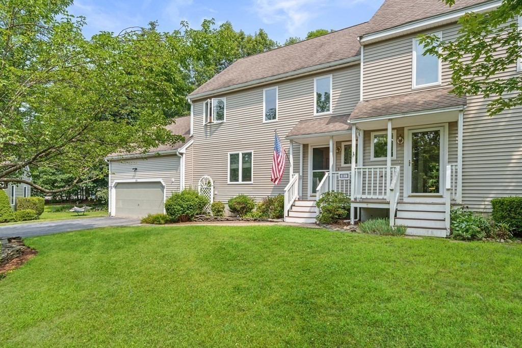 11 Longley Road, Unit H1 Shirley, MA 01464 - Photo 23 of 35 a front view of a house with a yard and green space