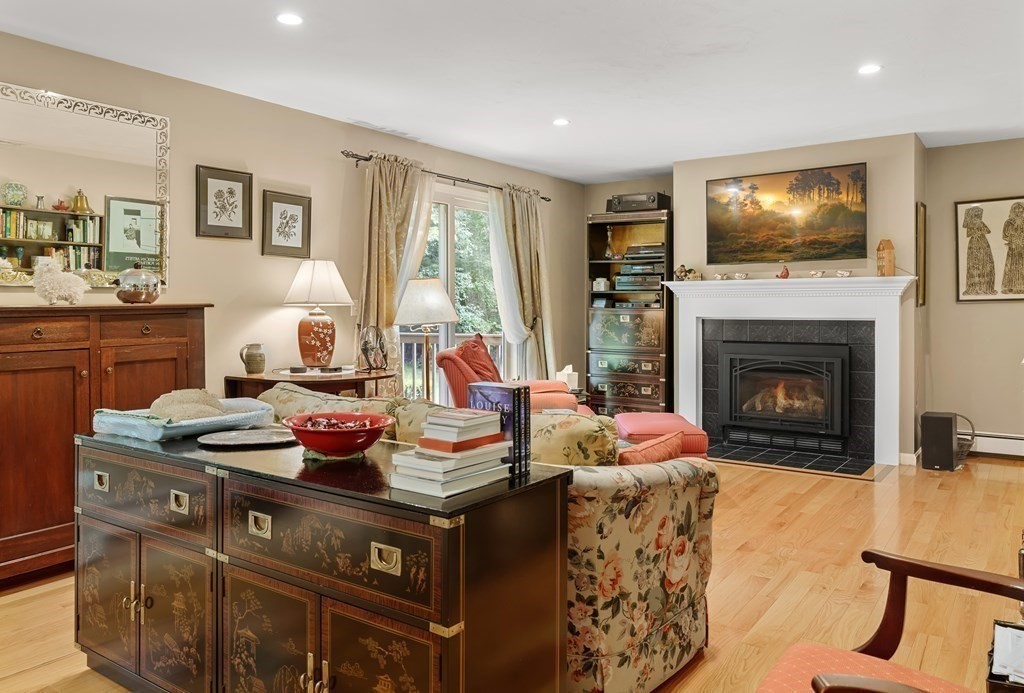 11 Longley Road, Unit H1 Shirley, MA 01464 - Photo 7 of 35 a living room with furniture a flat screen tv and a fireplace