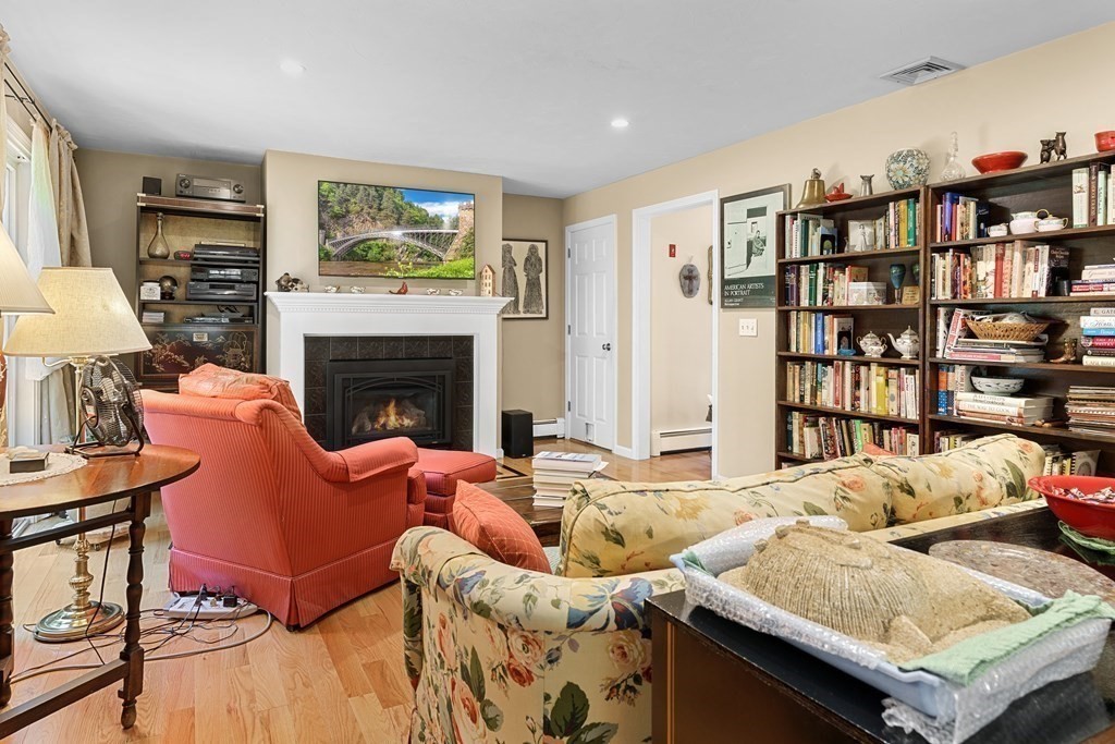 11 Longley Road, Unit H1 Shirley, MA 01464 - Photo 8 of 35 a living room with furniture and a fireplace