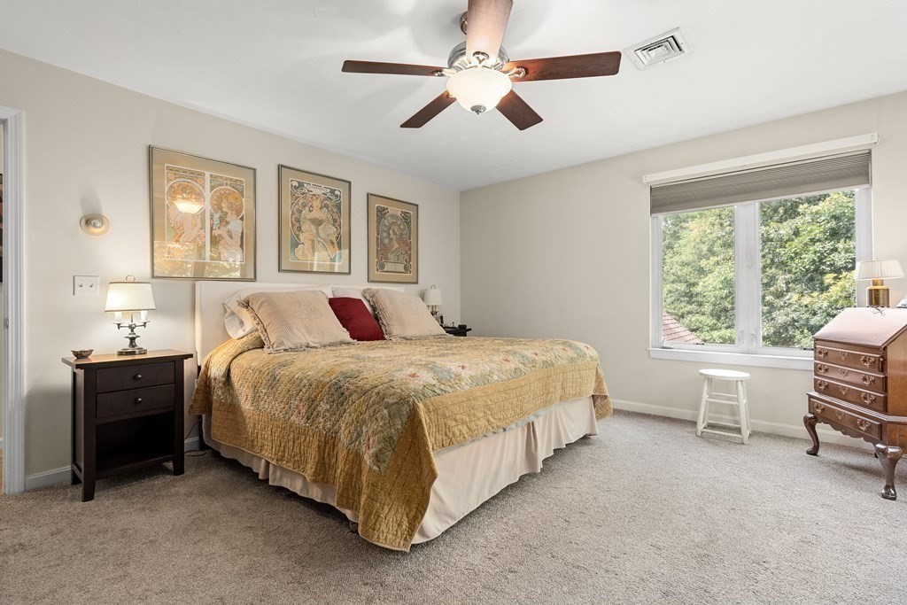 11 Longley Road, Unit H1 Shirley, MA 01464 - Photo 10 of 35 a bedroom with a large bed and windows