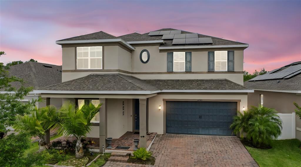 4783 Riverwalk Drive St. Cloud, FL 34771 - Photo 1 of 1 a front view of a house with garden