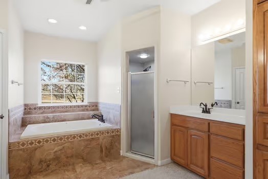 901 Kunde Road Seguin, TX 78155 - Photo 14 of 24 a spacious bathroom with a tub sink and mirror