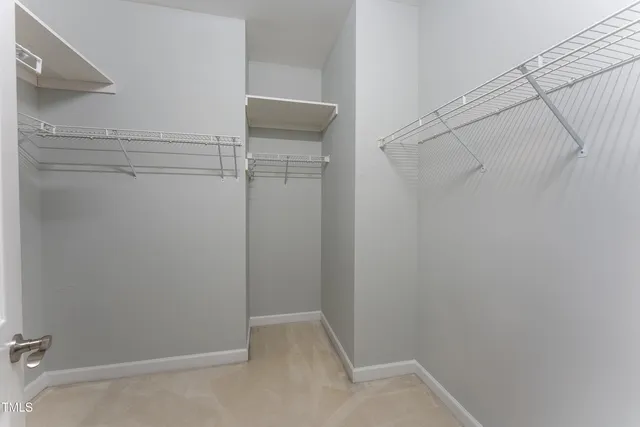 a view of a room with racks on the wall