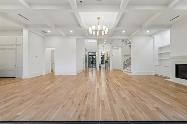 a view of spacious room with wooden floor