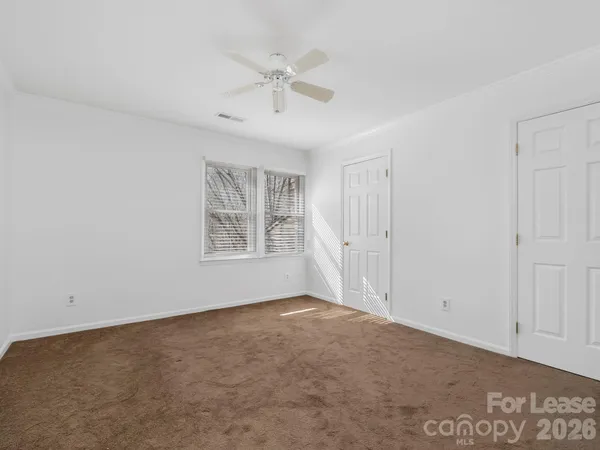 a bathroom with a granite countertop sink a mirror and a bathtub