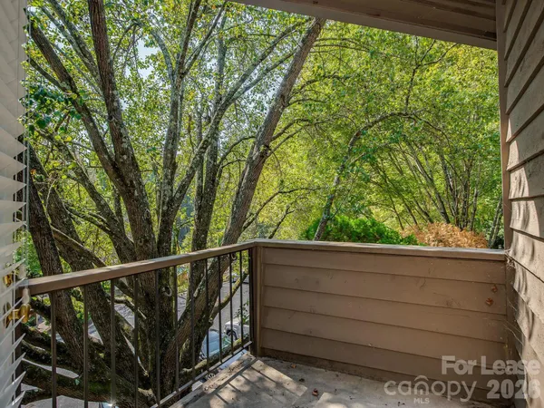a view of a house with a tree