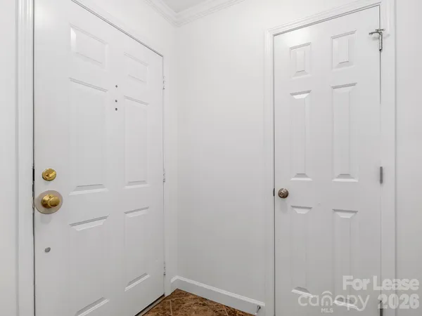 a kitchen with stainless steel appliances granite countertop wooden cabinets a stove a sink and a microwave