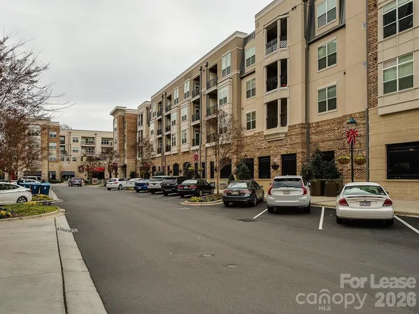 a front view of a building with parking space