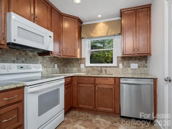 a bathroom with a shower and a sink