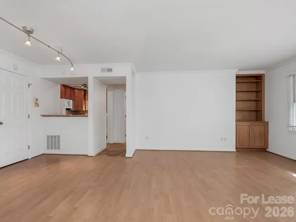 a view of an empty room with a window