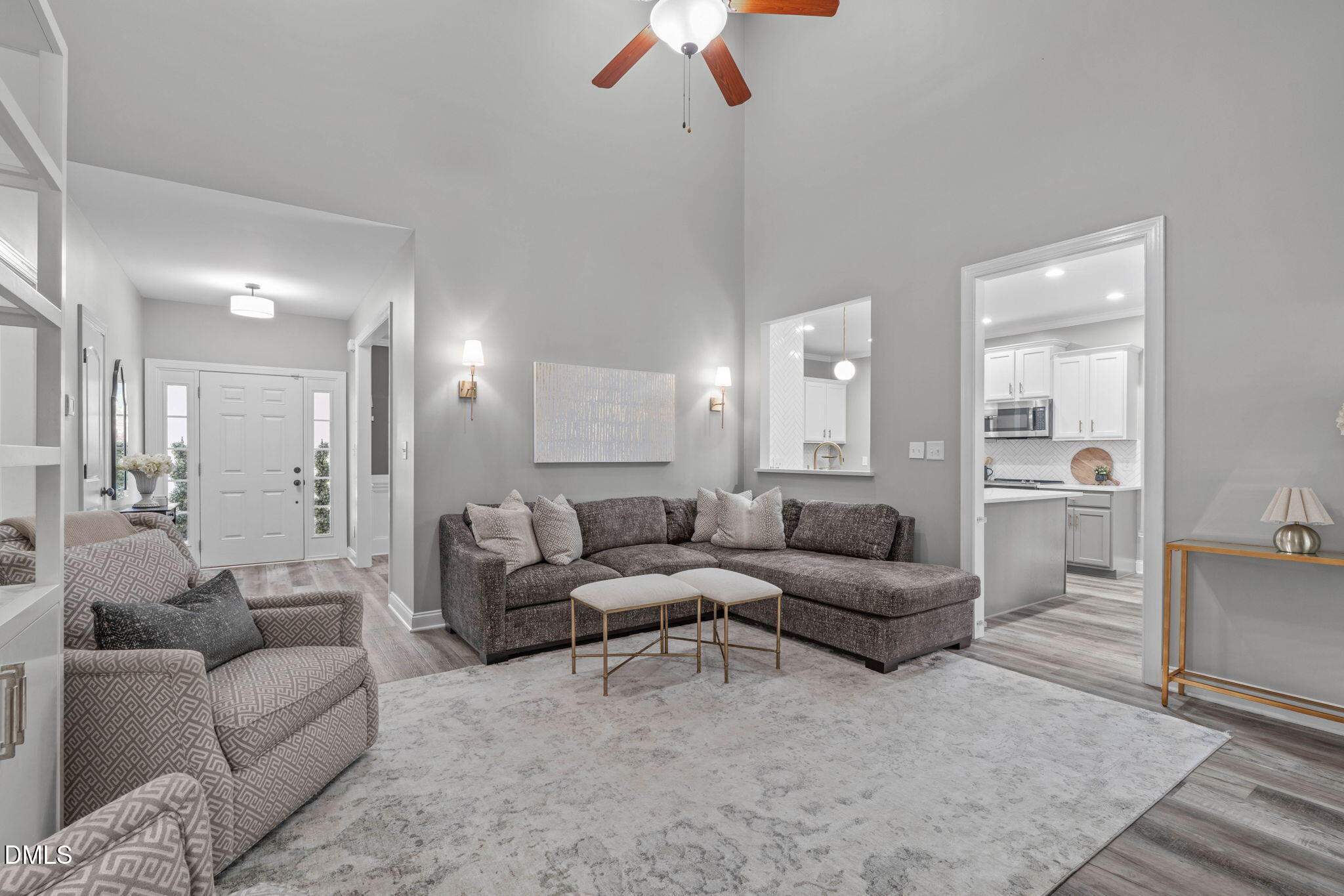 2450 Rolling Tracks Road Willow Spring, NC 27592 - Photo 16 of 64 a living room with furniture and a chandelier