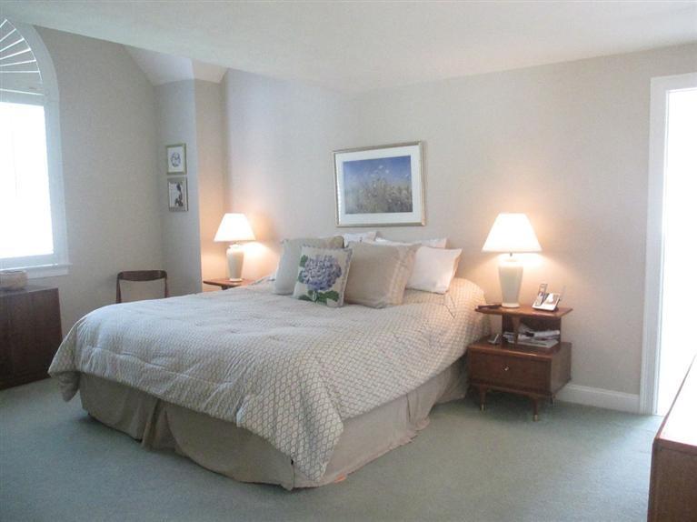 95 Cairn Ridge Road East Falmouth, MA 02536 - Photo 16 of 33 a bedroom with a bed and a lamp