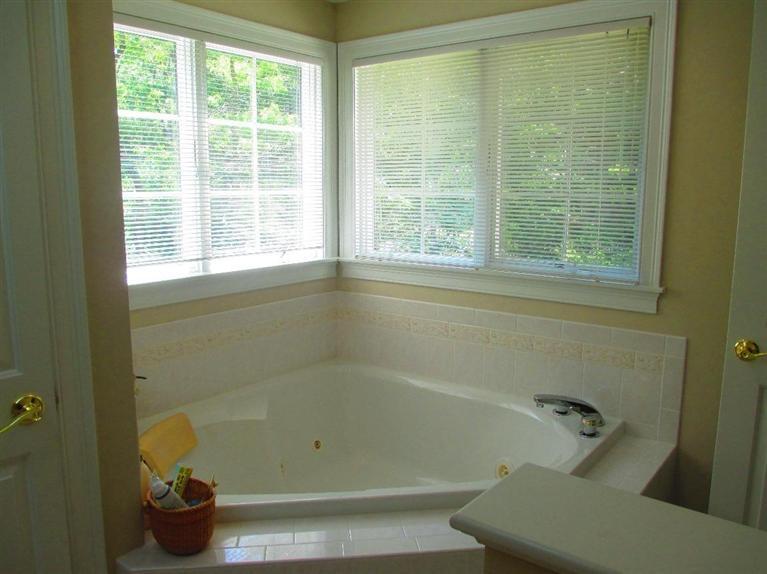 95 Cairn Ridge Road East Falmouth, MA 02536 - Photo 18 of 33 a bathroom with a shower and a bathtub