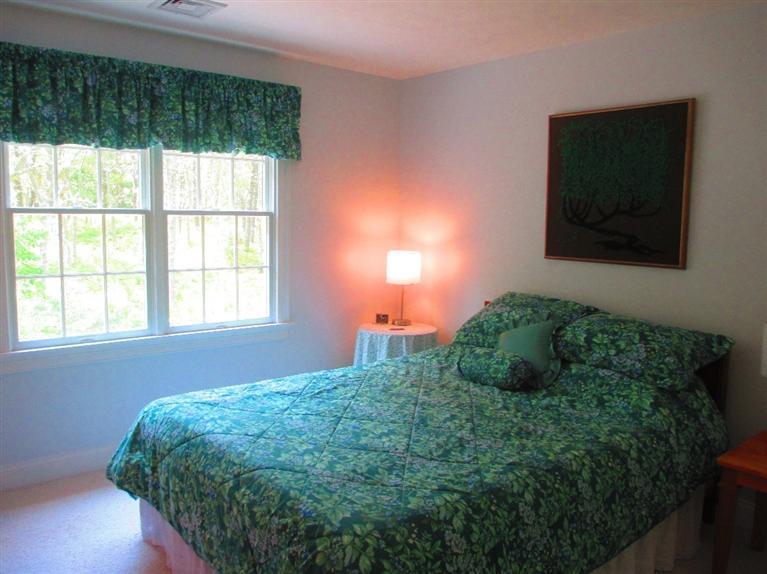 95 Cairn Ridge Road East Falmouth, MA 02536 - Photo 20 of 33 a bedroom with a bed and a window