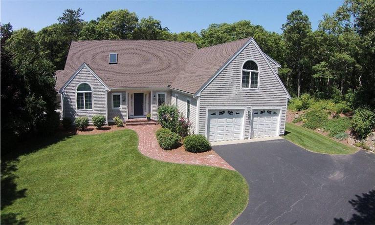 95 Cairn Ridge Road East Falmouth, MA 02536 - Photo 2 of 33 a view of a house with a yard and potted plants