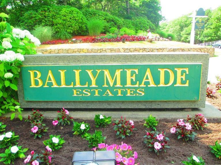 95 Cairn Ridge Road East Falmouth, MA 02536 - Photo 23 of 33 a sign that is sitting in front of flowers