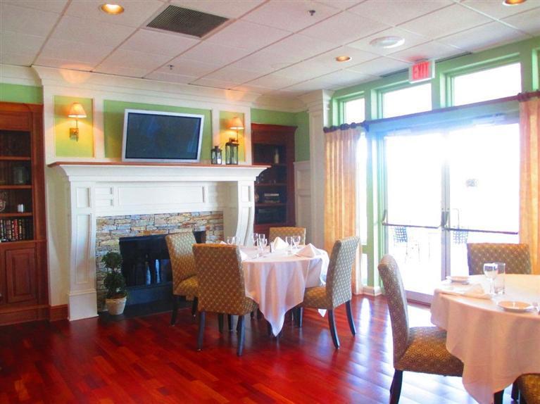 95 Cairn Ridge Road East Falmouth, MA 02536 - Photo 28 of 33 a living room with furniture and a fireplace