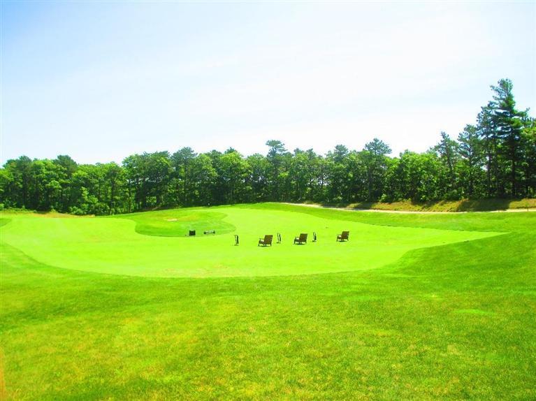 95 Cairn Ridge Road East Falmouth, MA 02536 - Photo 32 of 33 a view of a golf course with a lake