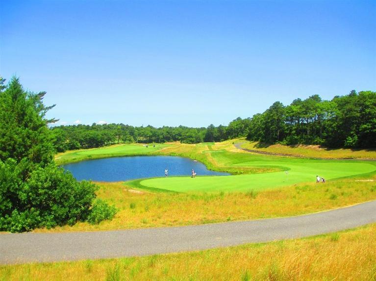 95 Cairn Ridge Road East Falmouth, MA 02536 - Photo 33 of 33 a view of a swimming pool with an outdoor space and seating area