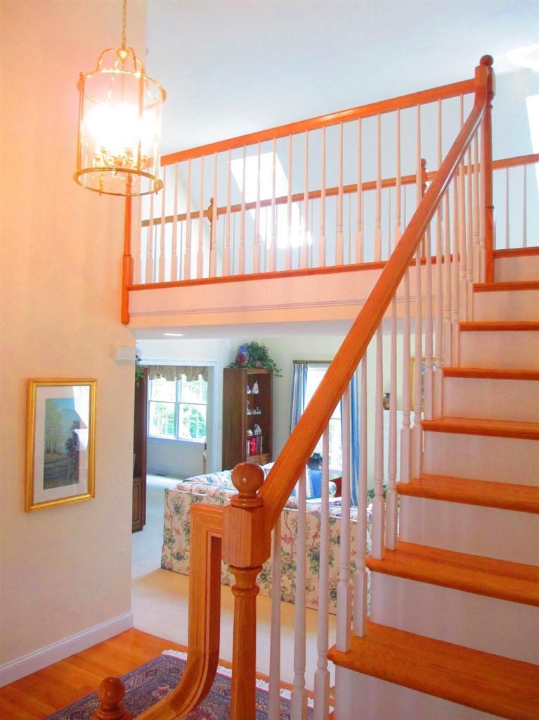 95 Cairn Ridge Road East Falmouth, MA 02536 - Photo 5 of 33 a view of entryway and hall with wooden floor