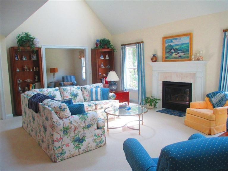 95 Cairn Ridge Road East Falmouth, MA 02536 - Photo 7 of 33 a living room with furniture and a fireplace