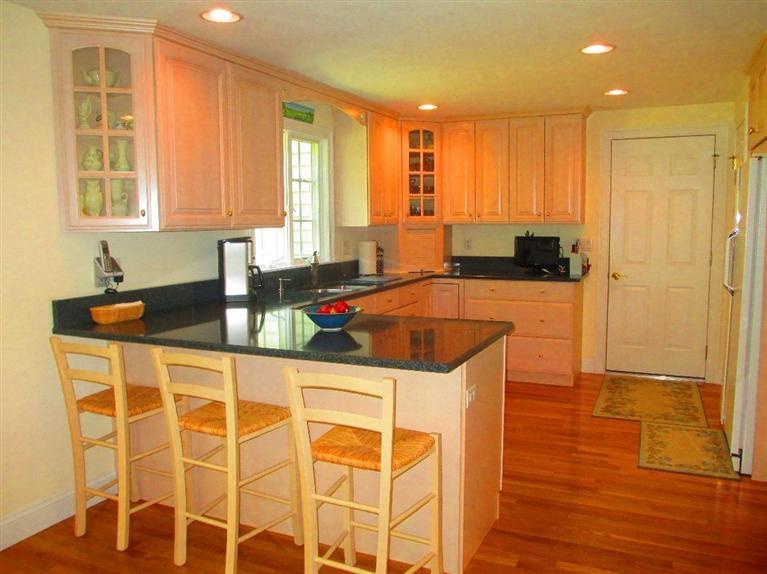 95 Cairn Ridge Road East Falmouth, MA 02536 - Photo 10 of 33 a kitchen with stainless steel appliances granite countertop a sink and cabinets